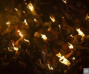 VIDEO - Zeci de mii de credinciosi au asistat la aprinderea Sfintei Lumini la Biserica Sfantului Mormant din Ierusalim