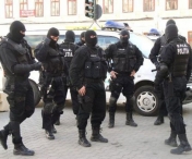 Procurorii DIICOT au descins la Politia Municipiului Timisoara. Un comisar a fost ridicat de mascati