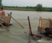 VIDEO - IMAGINI CUMPLITE cu doi soti care MOR INECATI in timp ce incercau sa traverseze apele involburate ale Jiului cu caruta