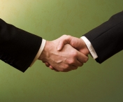 Drepturi sporite pentru angajatii din Romania. Klaus Iohannis a promulgat legea