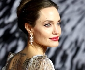 Angelina Jolie s-a facut de ras pe covorul rosu. Actritei i s-au aplicat prost niste extensii foarte ieftine