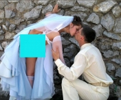 FOTO WOW! O mireasa a ajuns vedeta pe net! Si-a ridicat rochia de mireasa atunci cand si-a sarutat sotul, iar fotografia a devenit VIRALA